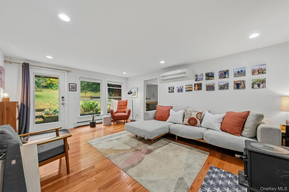 Light, airy, and inviting living room, with recessed lighting.