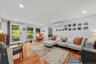 Light, airy, and inviting living room, with recessed lighting.