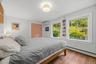 Primary bedroom with views towards the garden.