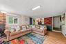 Finished basement with sliding glass doors to backyard.