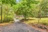 Driveway leads to property allow the front yard.