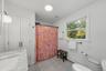 Spacious bathroom with recent renovations.