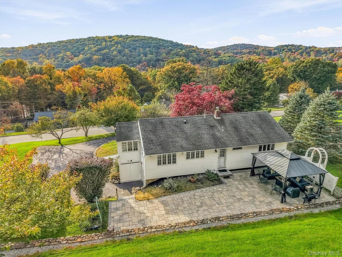 Back of home/property - look at that expansive patio!