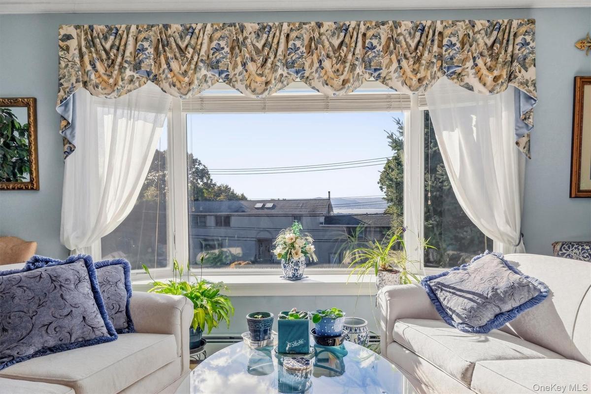 sunlit living area with large picturesque windows