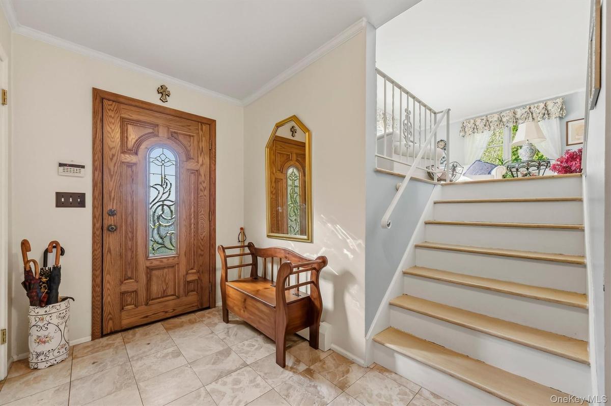 Bright and inviting foyer leading into the home