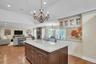 Granite counters and beautiful chandelier.