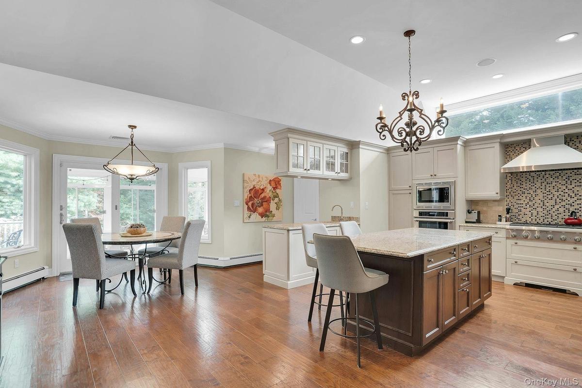 Soaring ceilings and engineered hardwood floors.