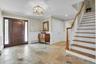 Gorgeous entry door and stne flooring.