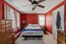 Ceiling fan and hardwood flooring complete this space
