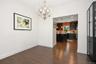 Hardwood-finish flooring, overhead chandelier.