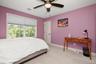 white paneled door, and neutral-toned carpeting