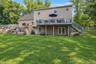 Raised rear deck and a large natural rock retaining wall