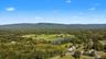 Expansive natural landscape with a prominent mountain range