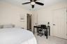 neutral wall color, two panel doors, black hardware