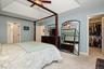 carpeted flooring, and a walk-in closet with built-in shelving