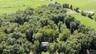 Extensive natural tree coverage and a surrounding green landscape