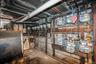 Utility room featuring oil tank and electric panel