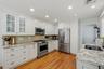 Large EIK kitchen w/white cabinetry, granite counter tops, SS appliances, recessed lighting!