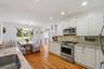 View of kitchen to large dining area.