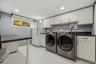 Great cabinet & counter space in updated laundryroom.