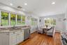 Wash dishes & meal prep with views to the backyard. Kitchen walkouts out to beautiful backyard.