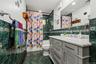 Tiled full bath w/newer vanity.