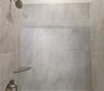 Jack-n-Jill Bathroom includes separate sink vanities, bathtub/shower combo