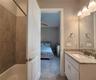 Jack-n-Jill Bathroom includes separate sink vanities, bathtub/shower combo