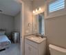 Jack-n-Jill Bathroom includes separate sink vanities, bathtub/shower combo