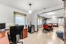 Open floor plan featuring large format tile flooring, neutral wall tones, and recessed ceiling lighting