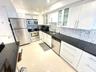 Nicely updated kitchen with SS appliances, granite counters & mosaic backsplash