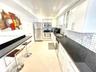 Nicely updated kitchen with SS appliances, granite counters & mosaic backsplash