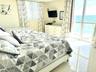 Main bedroom with Direct east ocean/beach view. 2 queen beds
