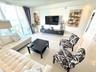 white leather sect sofa, Large Flat TV, upscale furnished