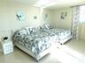 Main bedroom with Direct east ocean/beach view. 2 queen beds
