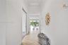 Tray ceiling with recessed lighting and neutral carpeting throughout
