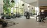 Fitness center featuring floor-to-ceiling windows, high ceilings, structural columns, and recessed pendant lighting