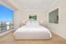 Floor-to-ceiling windows, wood-finish flooring, recessed lighting, and crown molding