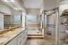 Primary Bathroom Dual sinks, separate shower and tub.