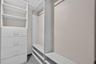 Primary bedroom walk in closet system