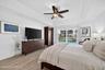 Primary suite with pool and lake views
