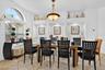 Formal dining with arched window