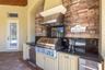There NEW built-in gas grill, refrigerator and bar sink area.