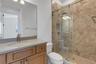 Bathroom# 4 has a fully tiled shower with European glass enclosure system.