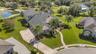 The home has a full brick paver driveway leading to a 4-car (YES, 4-CAR) garage, sidewalks and so much more.