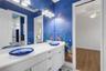Bathroom# 2 has a custom painted mural that will make children WANT to take a bath.