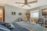 Primary Suite with Fireplace and Full Bayfront View!