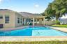 The covered lanai overlooks your private pool and privacy fenced backyard.