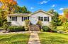 Freshly painted exterior complemented by beautifully maintained landscaping, creating inviting curb appeal.