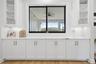 6 FT Pass through window from kitchen to rear porch with 11 FT of custom cabinetry.